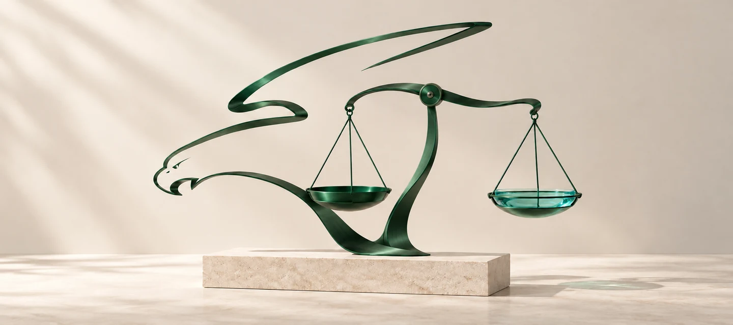 Sculptural artwork combining MLV&rsquo;s bird-inspired green metal curves with legal balance scales and aqua glass on an ivory stone base.