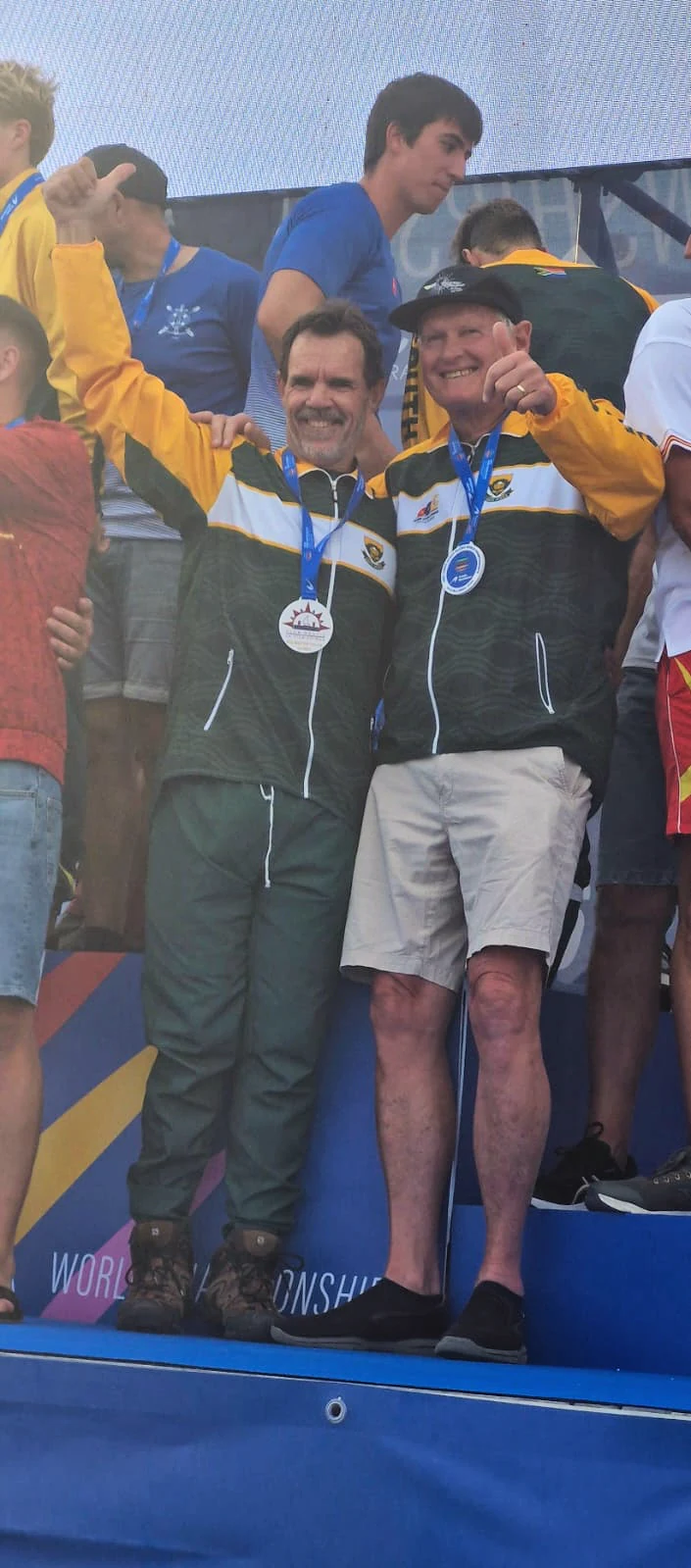 Daantjie Malan, identified by the client as the man on the left, celebrating on a podium with a fellow paddler.